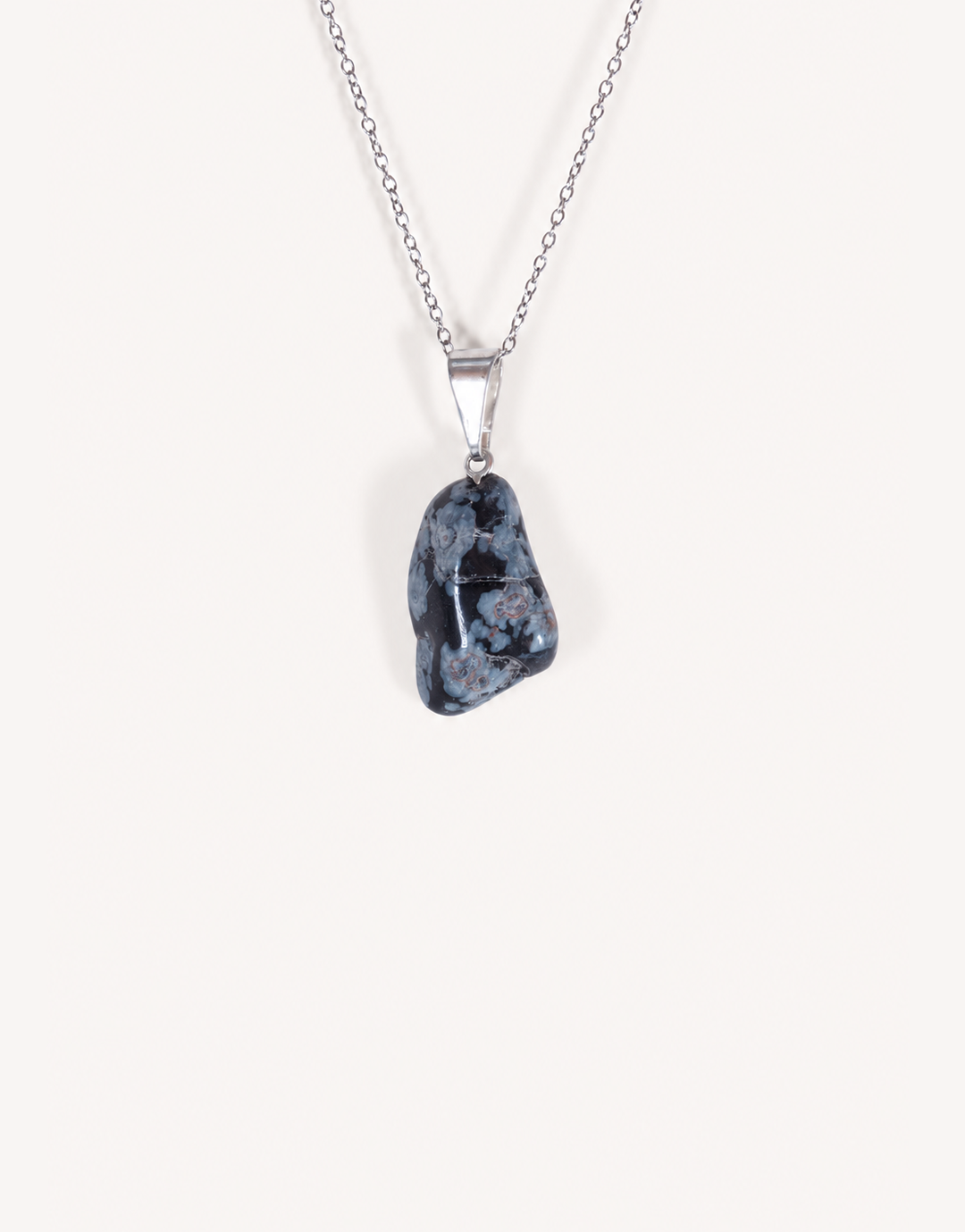 Natural polished snowflake obsidian pendant in jet black with white crystalline patterns on a complimentary 18-inch stainless steel chain.
