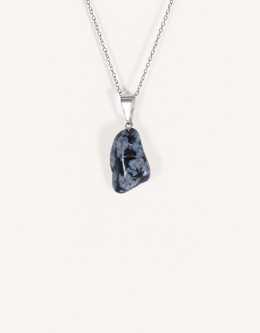 Natural polished snowflake obsidian pendant in jet black with white crystalline patterns on a complimentary 18-inch stainless steel chain.