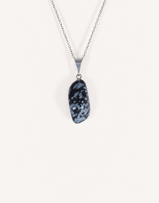 Natural polished snowflake obsidian pendant in jet black with white crystalline patterns on a complimentary 18-inch stainless steel chain.