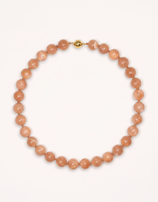 A 16-inch Natural Sunstone Choker crafted with polished 12mm beads in warm peach and terracotta tones with subtle metallic sparkle.