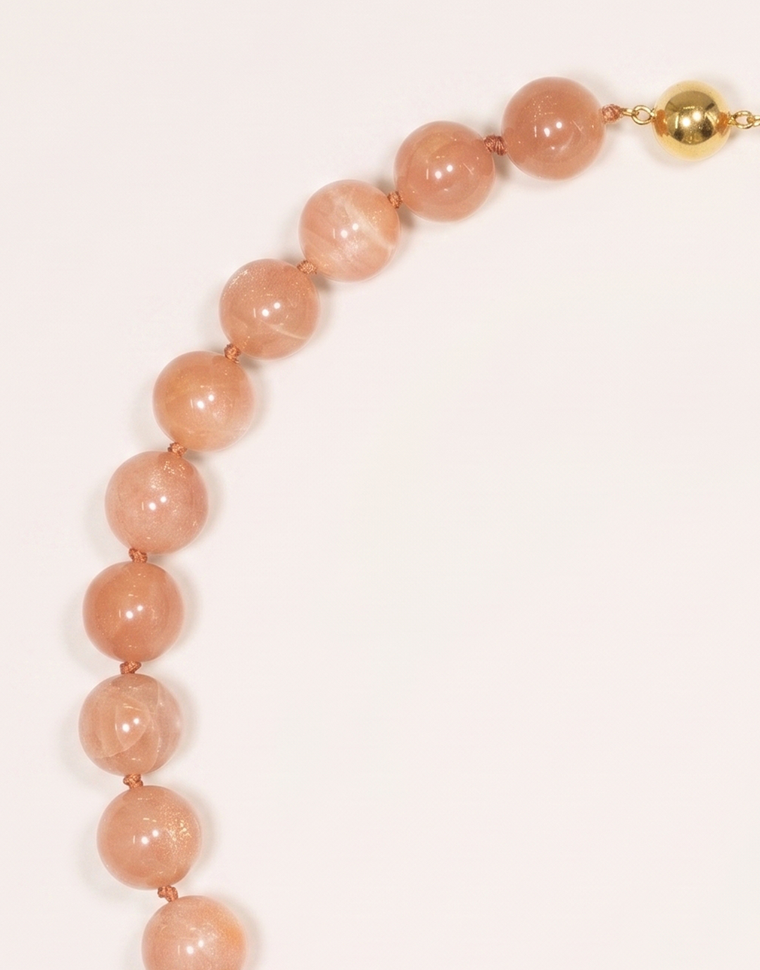 A 16-inch Natural Sunstone Choker crafted with polished 14mm beads in warm peach and terracotta tones with subtle metallic sparkle.