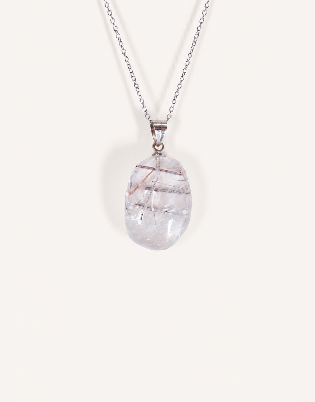 A Natural Tourmalinated Quartz Pendant showcasing clear quartz with black tourmaline needle inclusions on an 18-inch stainless steel chain.