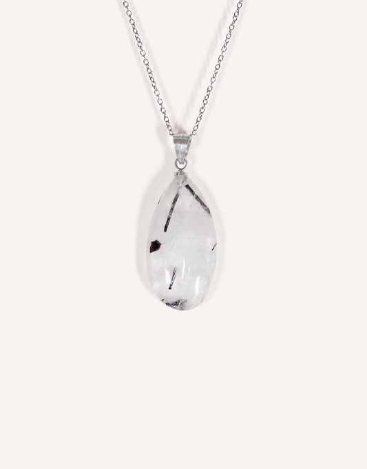 A Natural Tourmalinated Quartz Pendant showcasing clear quartz with black tourmaline needle inclusions on an 18-inch stainless steel chain.
