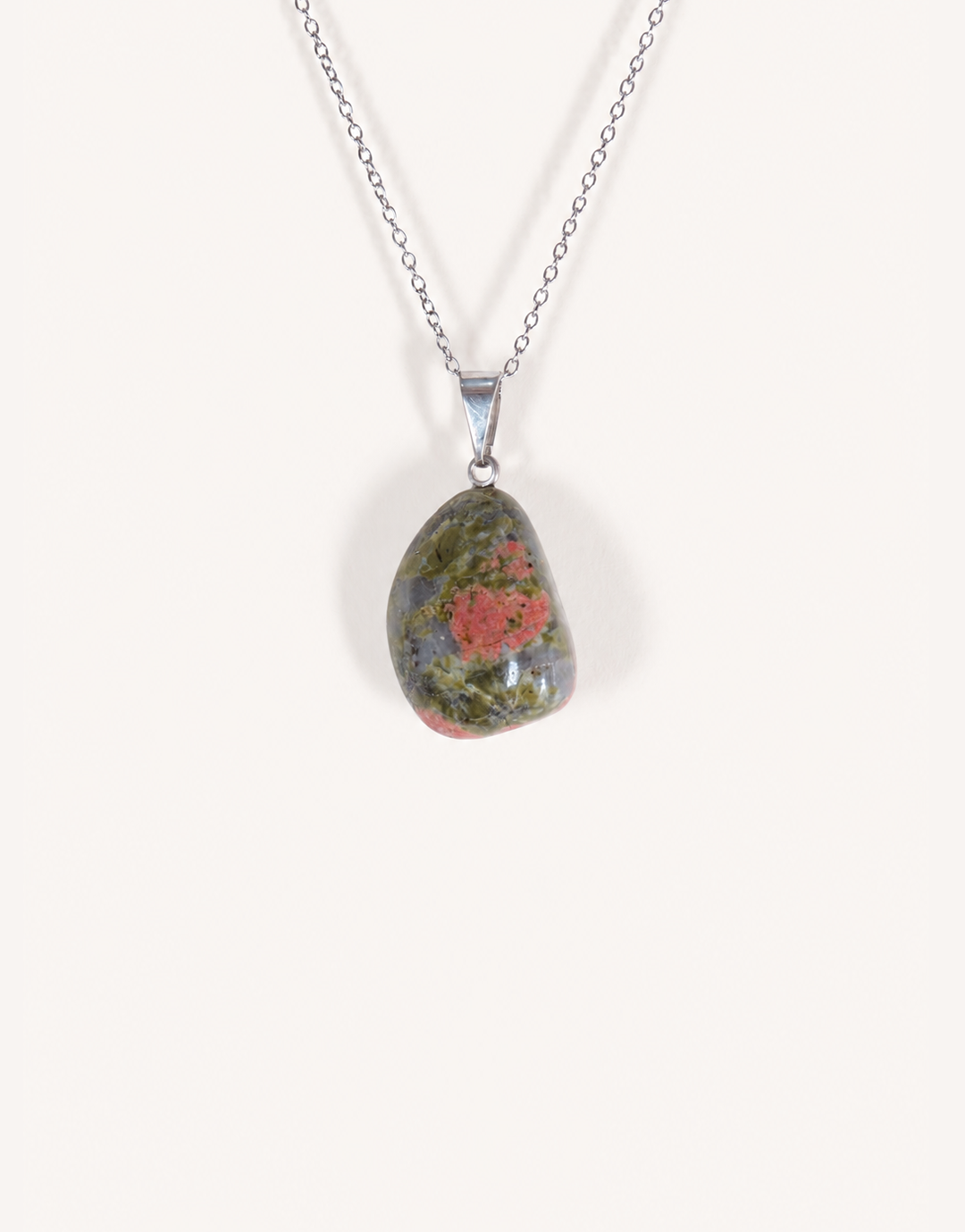 A Natural Unakite Pendant featuring a smooth green and coral-pink tumbled stone on an 18-inch stainless steel chain.