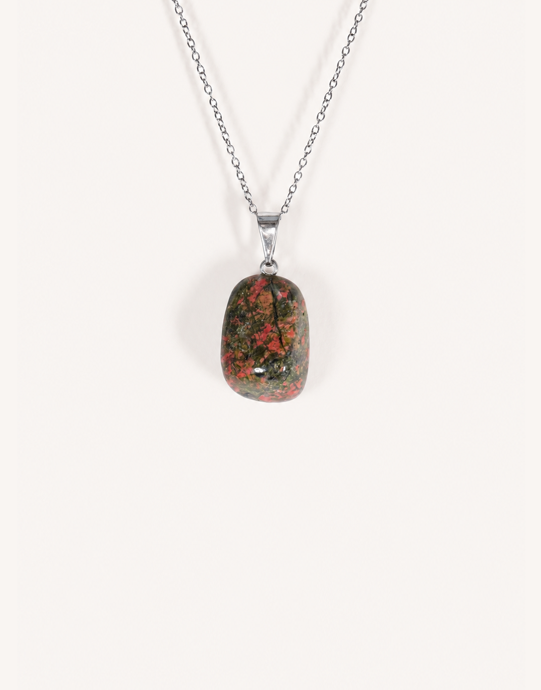 A Natural Unakite Pendant featuring a smooth green and coral-pink tumbled stone on an 18-inch stainless steel chain.
