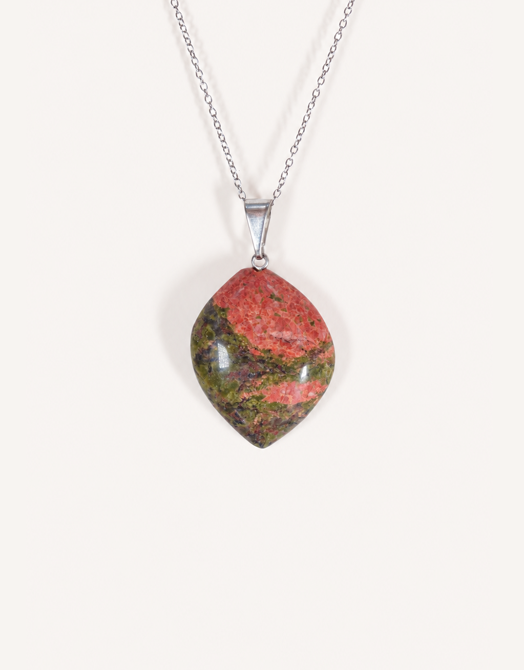 A Natural Unakite Pendant featuring a smooth green and coral-pink tumbled stone on an 18-inch stainless steel chain.